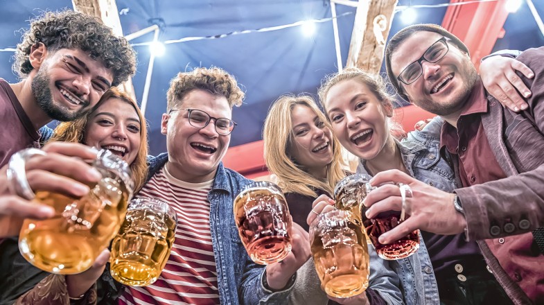 People enjoying beers during Oktoberfest Beer festival in Germany in September.